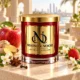 MAISON NOOR Apple Ginger Spritz red glass candle with gold lid, styled with apple, ginger, star anise, cloves, strawberry and jasmine on a sunlit terrace.
