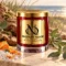 MAISON NOOR Beachwood red glass candle with gold lid, styled with driftwood, moss, eucalyptus, sage, sea salt and orange peel beside coastal dunes.