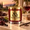 MAISON NOOR Black Cherry Merlot red glass candle with gold lid, styled with dark cherries, black currants, red wine, oak, vanilla and cloves at sunset.