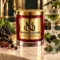 MAISON NOOR Black Currant Absinthe red glass candle with gold lid, styled with black currants, blackberries, star anise, basil, eucalyptus and an absinthe glass.
