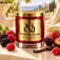 MAISON NOOR Black Raspberry Vanilla red glass candle with gold lid, styled with dark and red raspberries, cherry, strawberry, plum and vanilla on ivory stone.