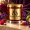 MAISON NOOR Black Violet and Saffron red glass candle with gold lid, styled with violets, dark rose, raspberries, bergamot, saffron and leather.