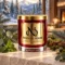 MAISON NOOR Blue Spruce red glass candle with gold lid, styled with blue spruce, eucalyptus, mint, moss and cedar in a luxury alpine chalet.
