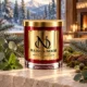 MAISON NOOR Blue Spruce red glass candle with gold lid, styled with blue spruce, eucalyptus, mint, moss and cedar in a luxury alpine chalet.