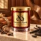 MAISON NOOR Cinnamon Stick red glass candle with gold lid, styled with cinnamon, nutmeg, cloves, vanilla, tonka beans and wood on ivory stone.