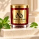 MAISON NOOR Peppermint Element candle with fresh peppermint sprigs and leaves on sculptural ivory limestone steps.