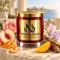 MAISON NOOR White Peach Blossom candle with peach, orange peel, rose, sweet pea, mango and teakwood by the sea.